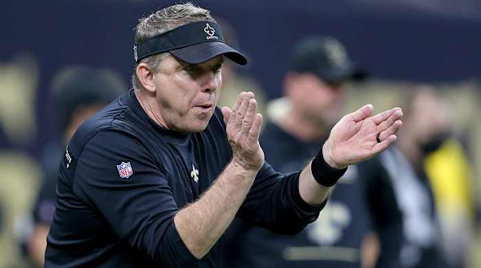 Sean Payton claps during a Saints game.